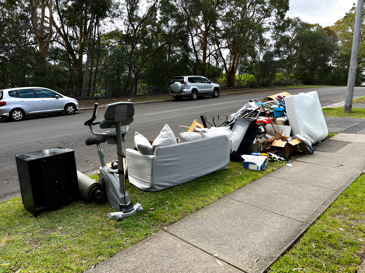 Dump It Dude Junk Solutions team performing garage and attic decluttering for Fullerton homeowners - top-rated junk removal service