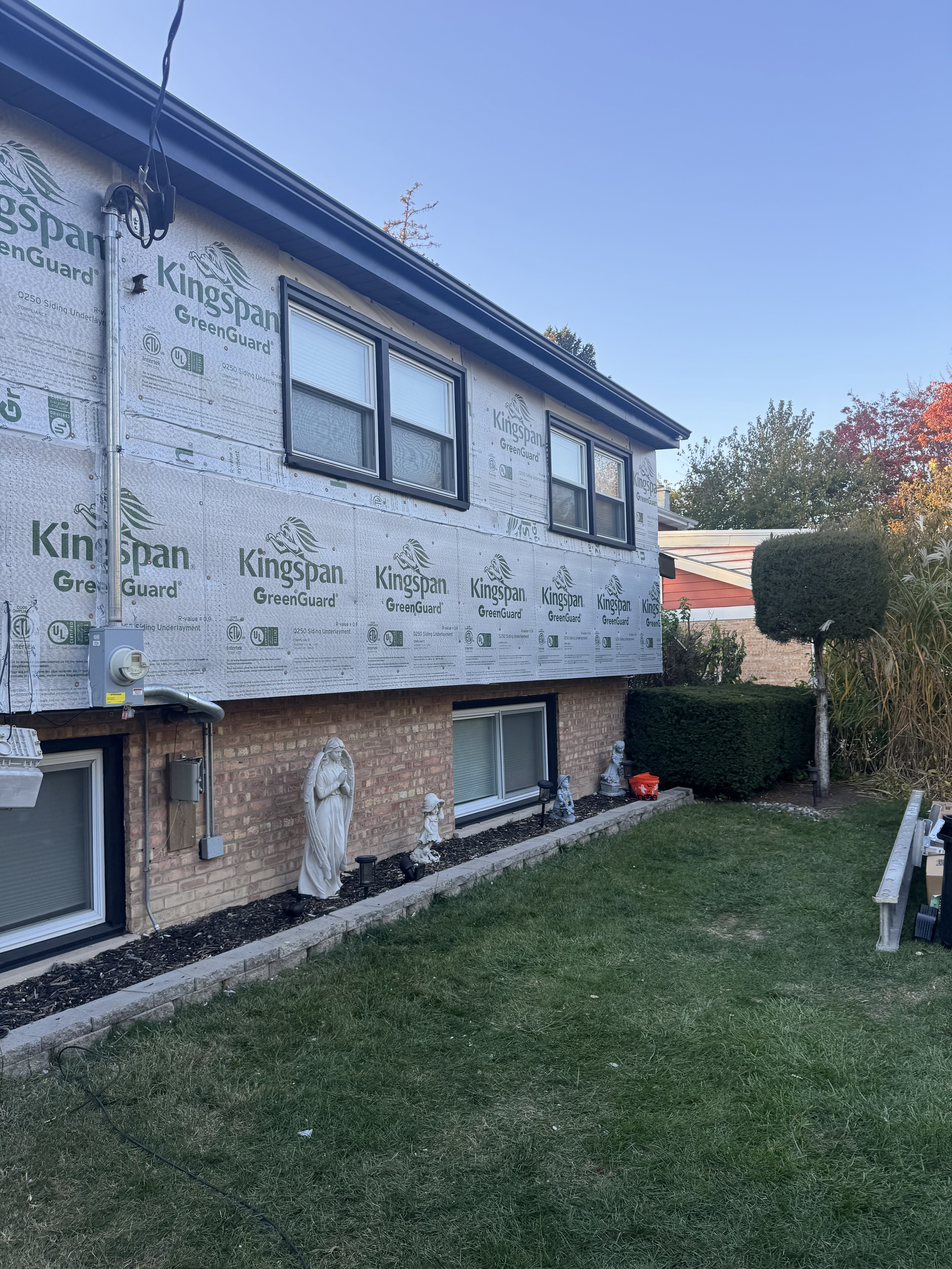 JV Roofing team performing siding repair for Southwest Suburbs of Chicago homeowners - top-rated roofing service