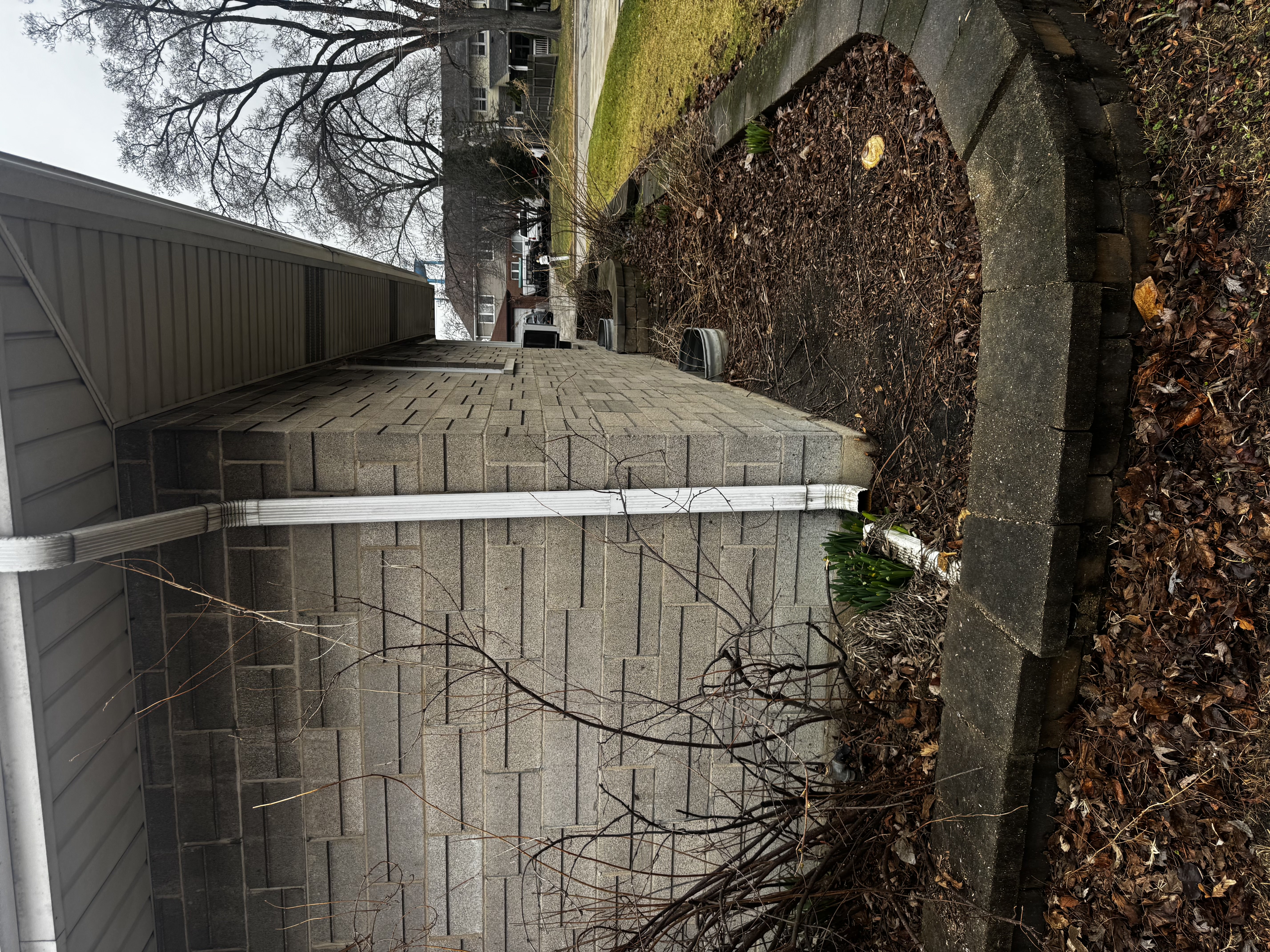 JV Roofing team performing gutter cleaning for Southwest Suburbs of Chicago homeowners - top-rated roofing service