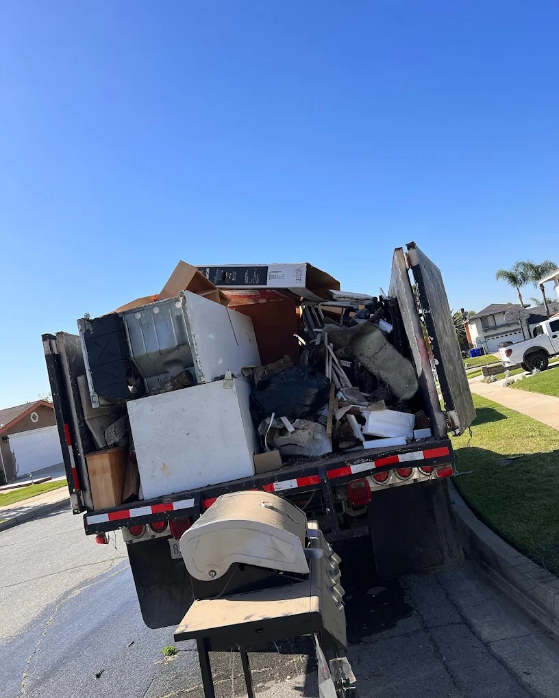 M&Ms Junk Removal & Moving team performing attic cleanout for Fontana homeowners - top-rated junk removal service